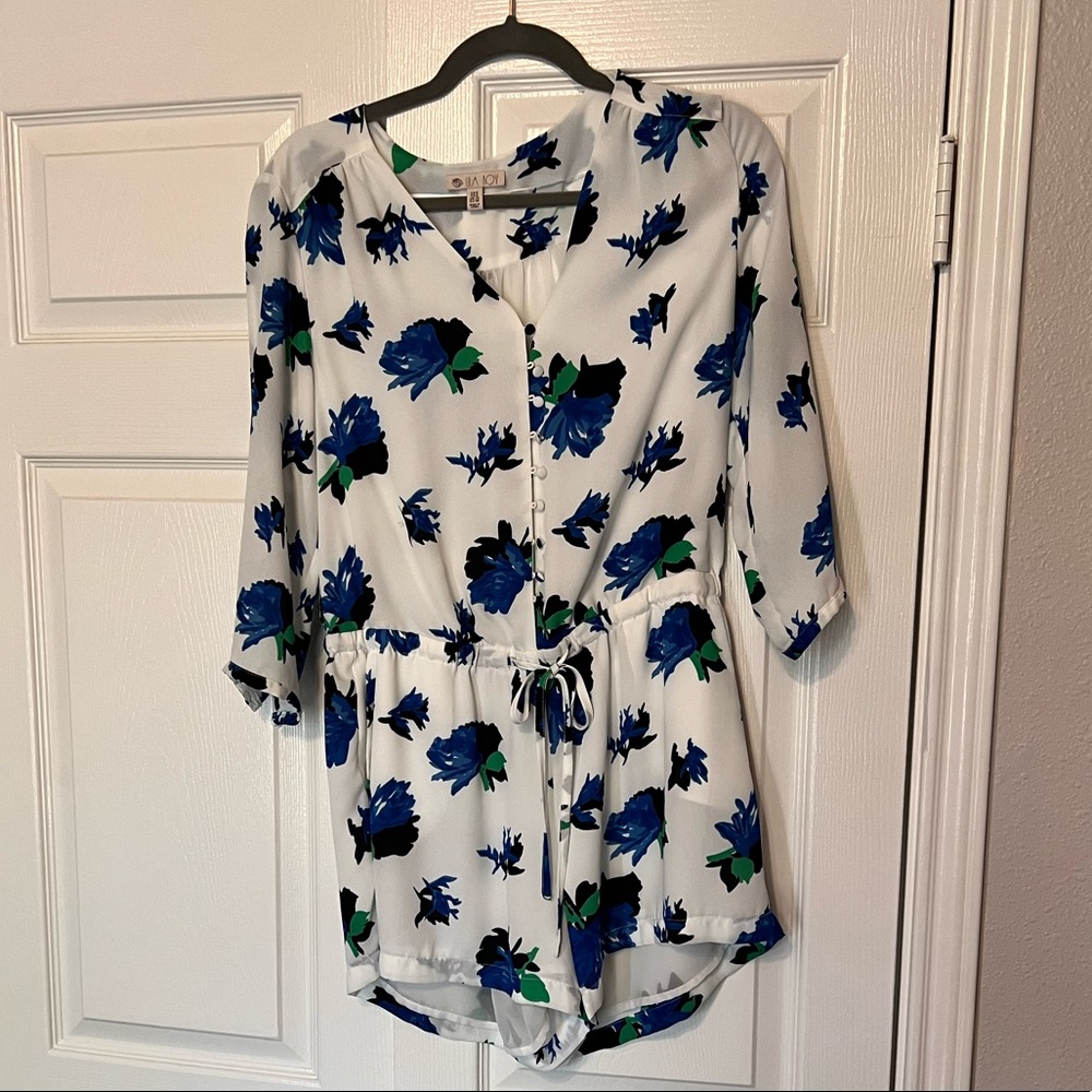 White romper with blue floral pattern